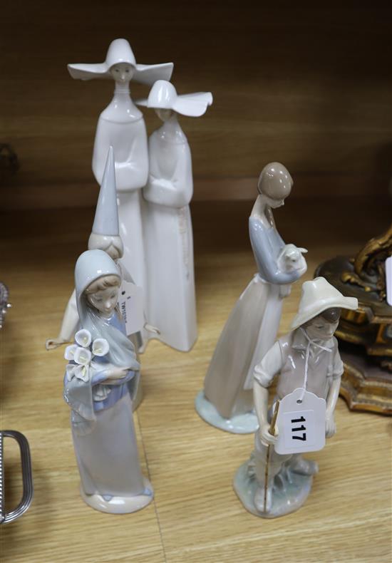 A Lladro figure of two nuns, another of a fairy godmother and three other Lladro figures tallest 34cm